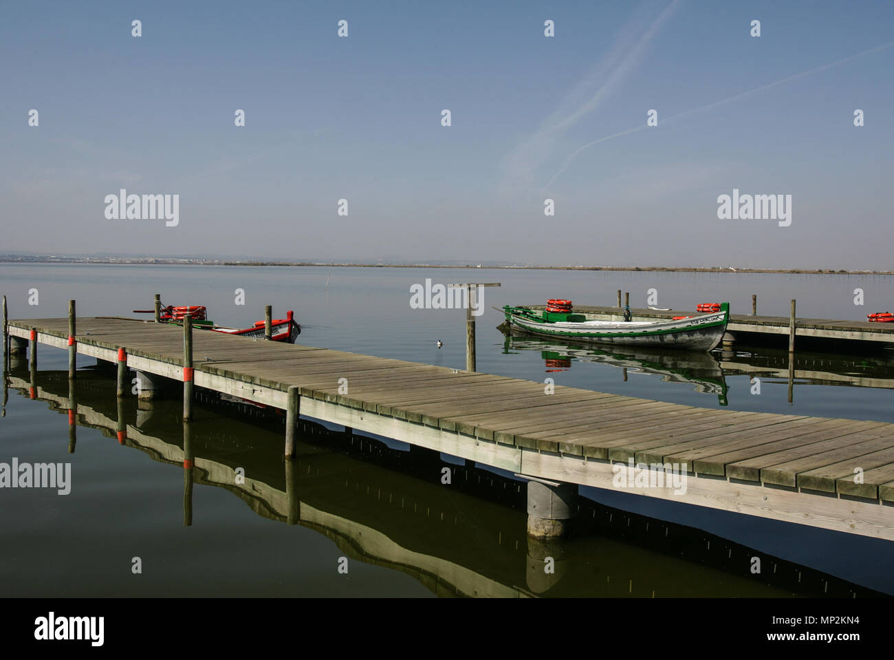 the boats for the visitors wait in the wharf of the natural reserve of La Albufera in Valencia Stock Photo