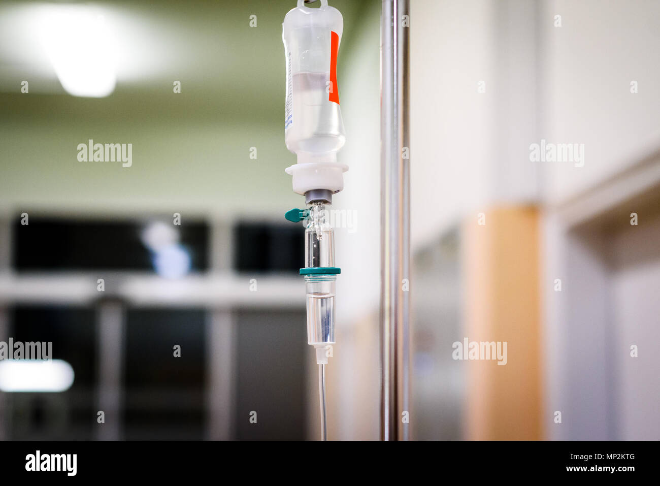 Intravenous therapy iv infusion set and bottle on a pole. Liquid saline