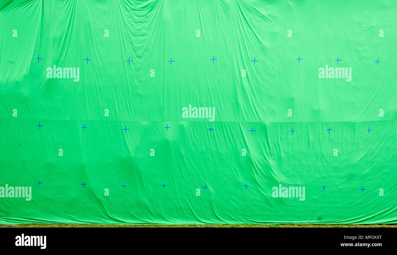 Giant green screen chroma key background on commercial set. Big green  background for added special effects in post production Stock Photo - Alamy