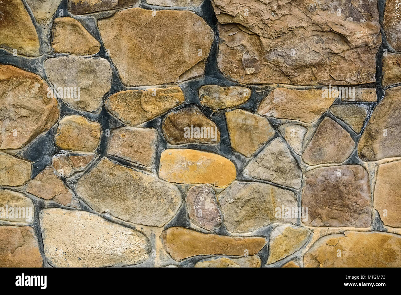 Closeup of beige rough uneven actique stone wall Stock Photo - Alamy