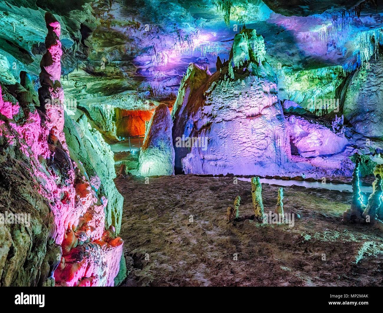 Wonderful Prometheus Cave. Stalactites and stalagmites in the illuminated cave Stock Photo