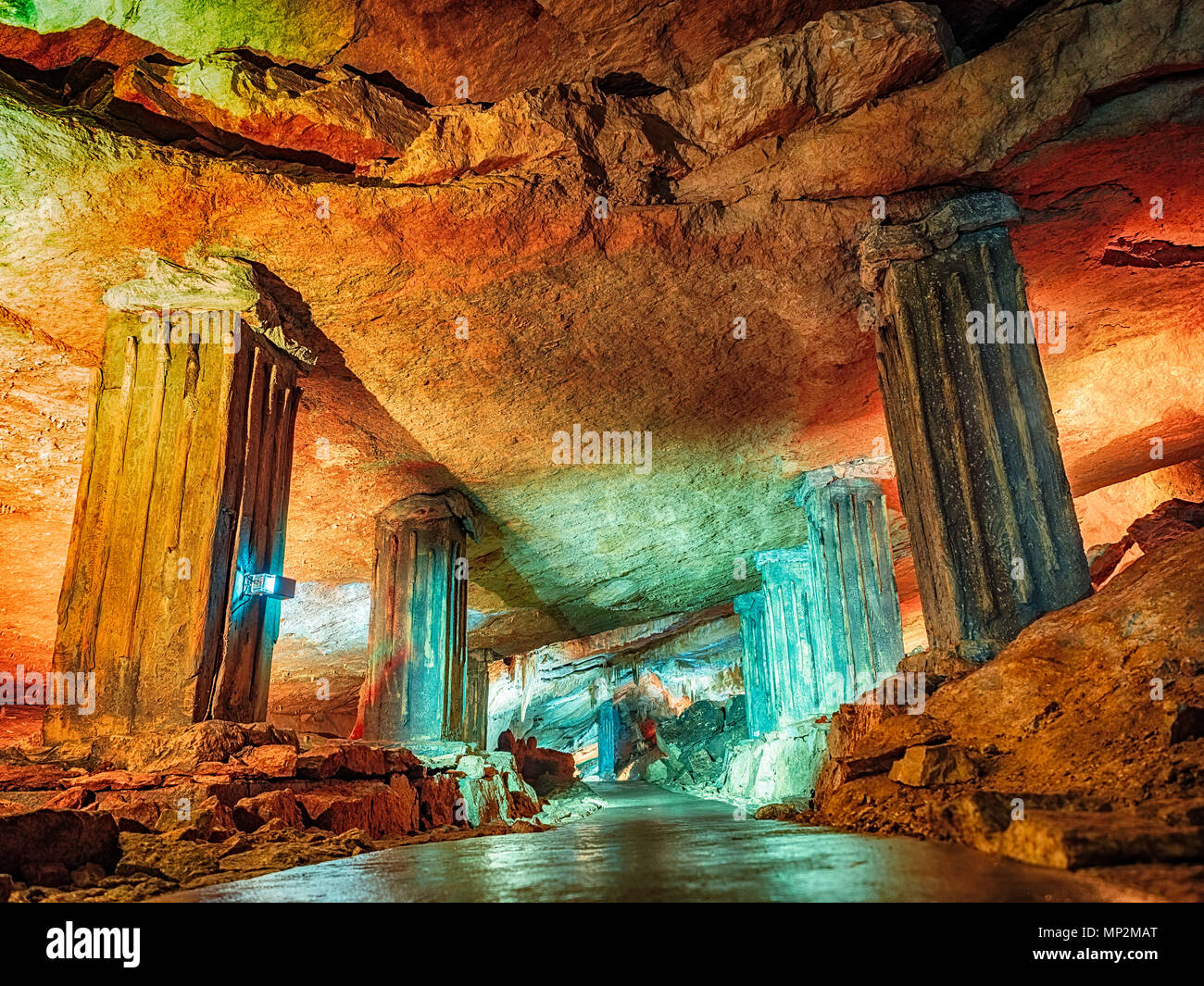 Wonderful Prometheus Cave. Stalactites and stalagmites in the illuminated cave Stock Photo