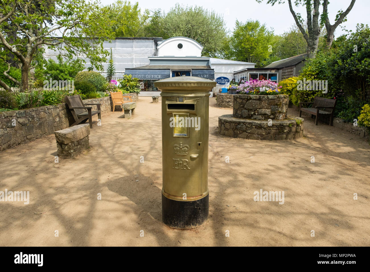 The Gold Postbox in the main village on the island of Sark. Stock Photo