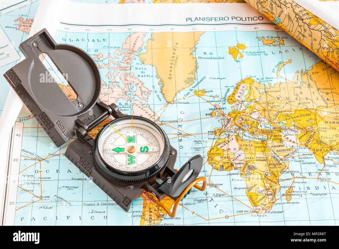 A compass on a geographical map to plan a trip Stock Photo Alamy