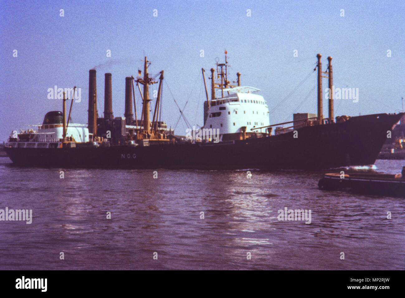 Possible Deptford or Woolwich Power station in the 1960s with German vessel NOG sailing past Stock Photo