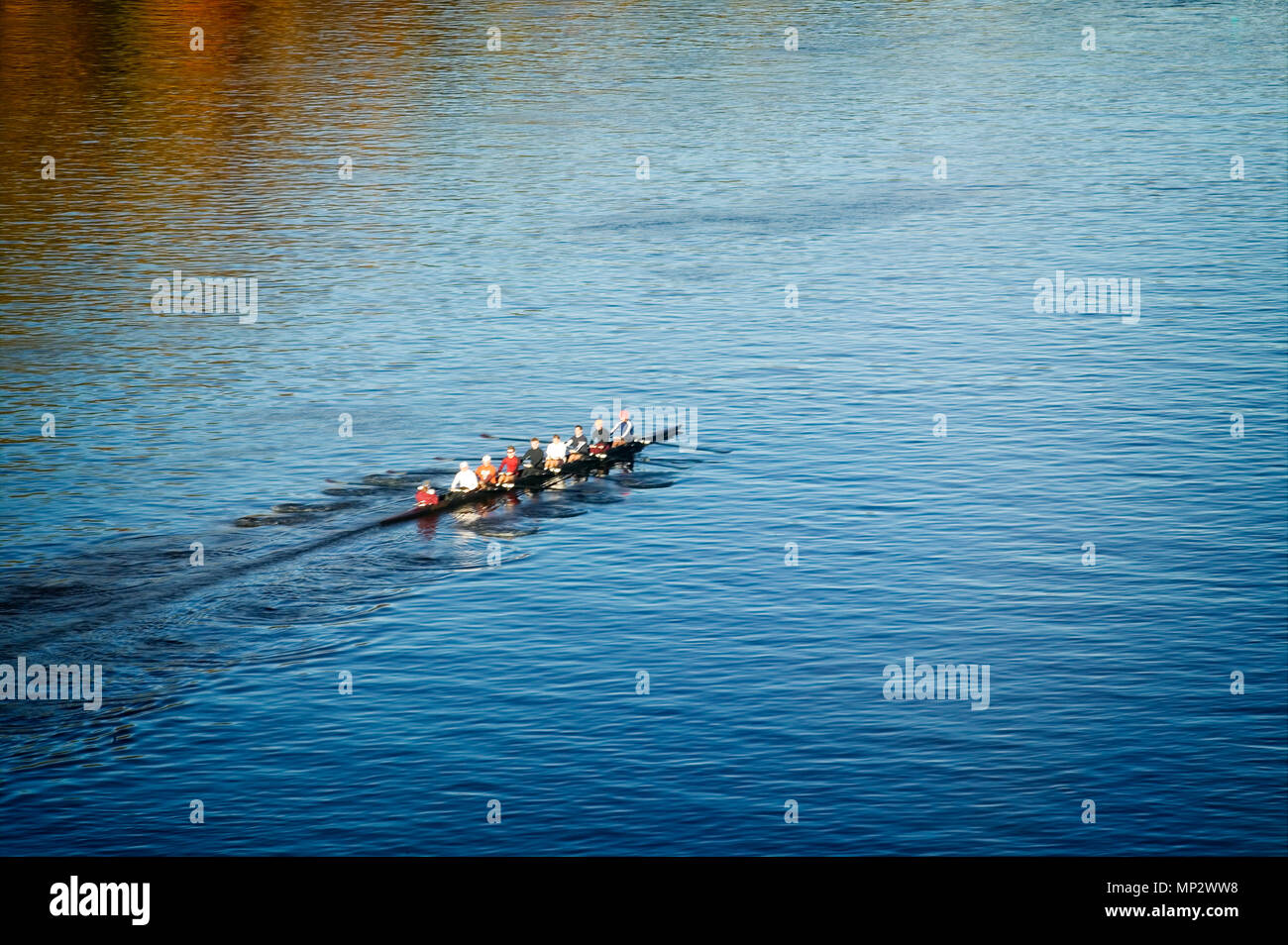 A rowing team practices on the Mississippi River in Minneapolis