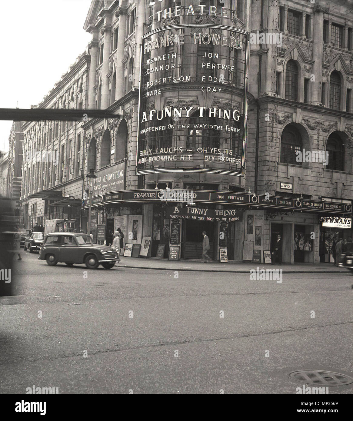 1963, historical picture of London's West End, showing the exterior of the Strand Theatre at the Aldwych, which is staging, 'A Funny Thing Happened on the Way to the Forum', a vaudeville musical comedy by American composer and lyricist Stephen Sondheim, starring British actor and comedian Frankie Howerd. The musical was a big hit and ran for nearly two years. Stock Photo