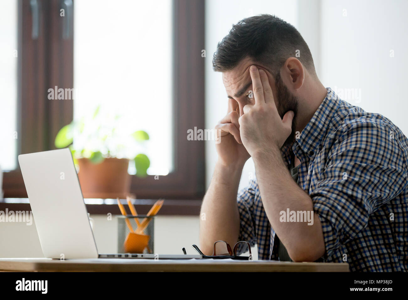 Concerned male thinking about problem solution Stock Photo