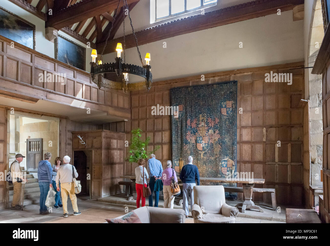 Visitors in the Hall at Haddon Hall, near Bakewell, Derbyshire, England, UK Stock Photo