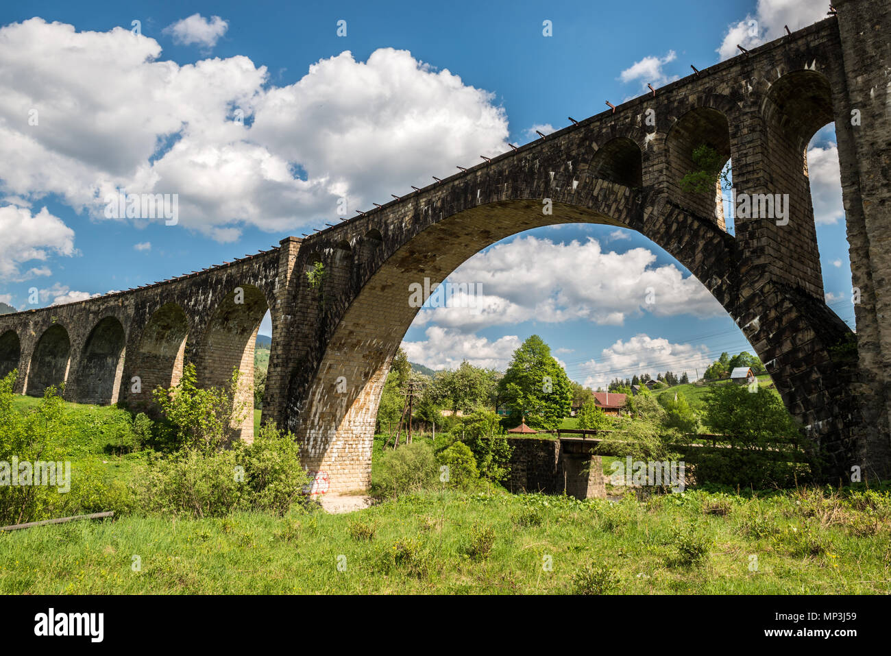 Old railway bridge, old viaduct Vorohta, Ukraine. Carpathian Mountains, wild mountain landscape. Stock Photo