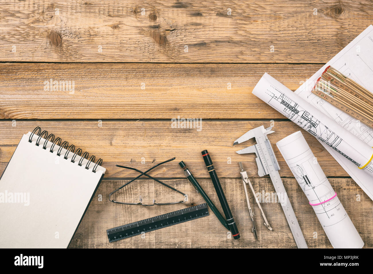 Architect workplace top view. Project construction blueprints and