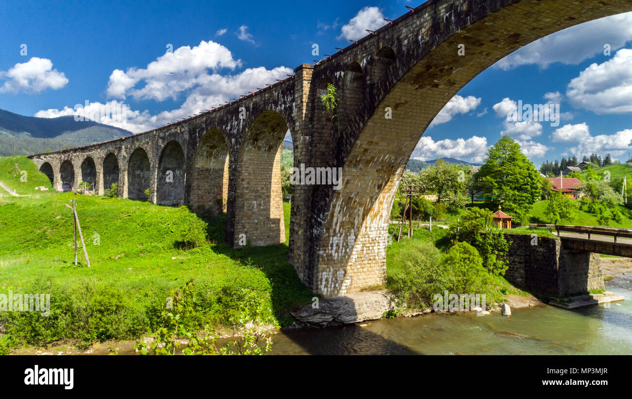 Old railway bridge, old viaduct Vorohta, Ukraine. Carpathian Mountains, wild mountain landscape. Stock Photo