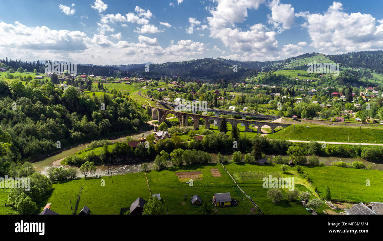 Aerial view of Carpathian mountains in summer. Village in the mountains ...