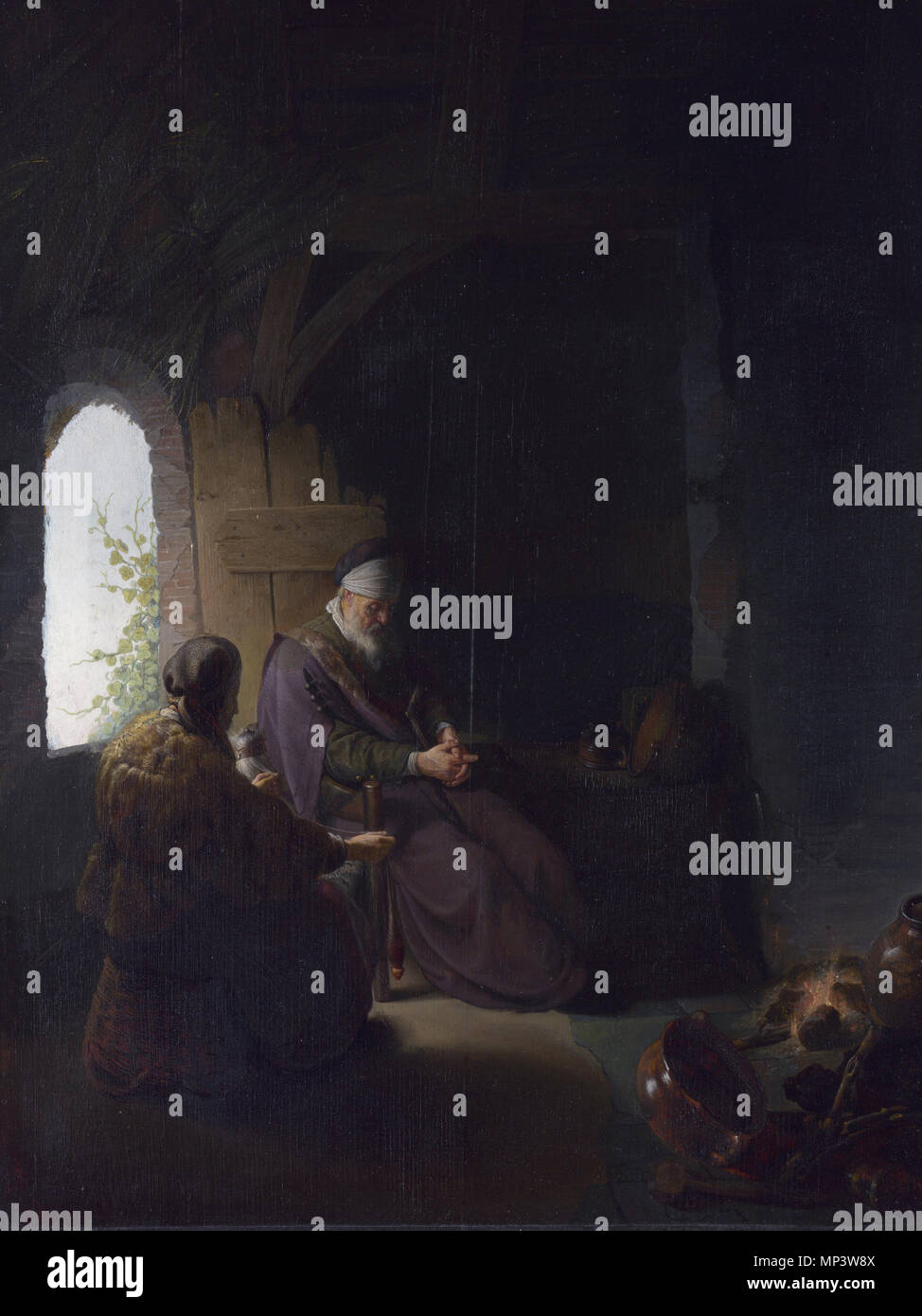 Anna and the Blind Tobit  *oil on panel  *63.8 x 47.7 cm  *circa 1630   Anna and the Blind Tobit .  The story of Anna, her husband Tobit and their son Tobias is told in the apocryphal Book of Tobit. God tested them by reducing them to poverty and causing Tobit's blindness. In the 17th century they were considered to be examples of piety in adversity. This painting was engraved as the work of Rembrandt during his lifetime, but it has subsequently been argued that its meticulous detail suggests that it was either a collaboration between Rembrandt and his Leiden pupil Gerrit Dou, or by Dou alone. Stock Photo