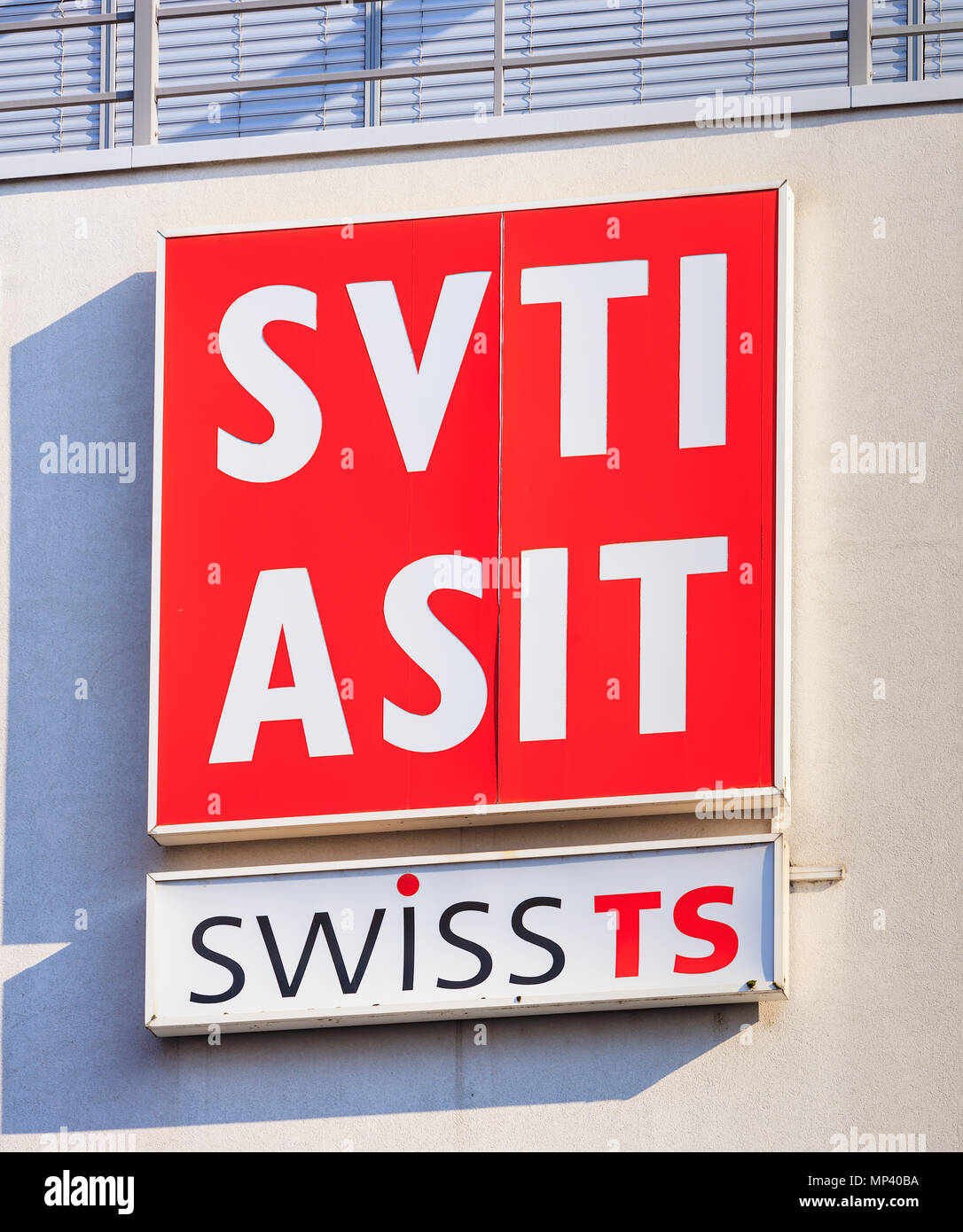 Sign of the SVTI on the wall of a building. SVTI is the abbreviation for the Swiss Association for Technical Inspections in German Stock Photo