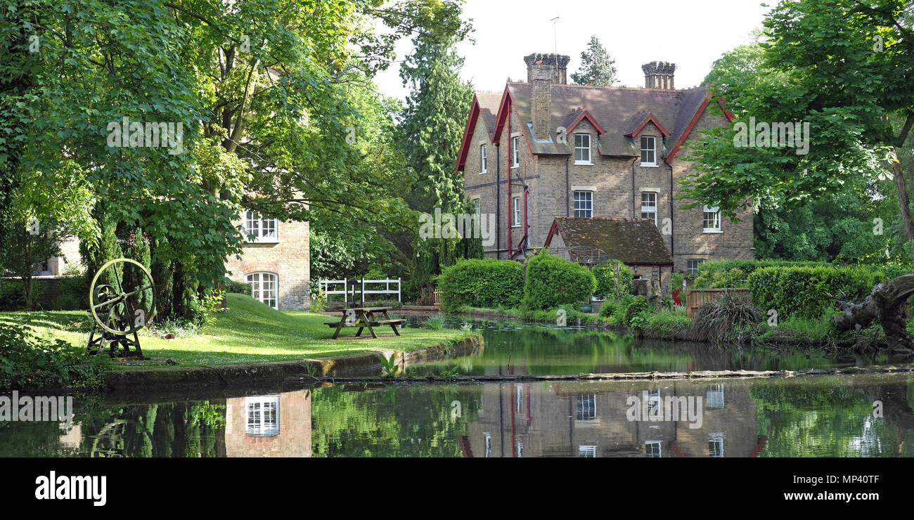 View of old mill buildings by the River Gade in Grove Mill Lane in Watford Stock Photo