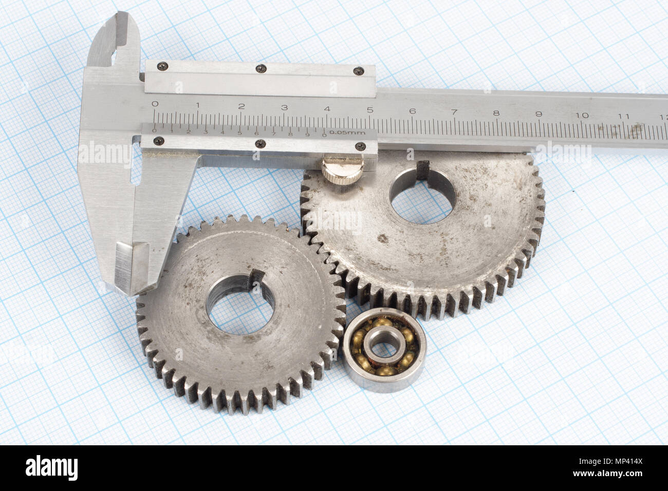 gear, bearing and caliper on graph paper background Stock Photo Alamy