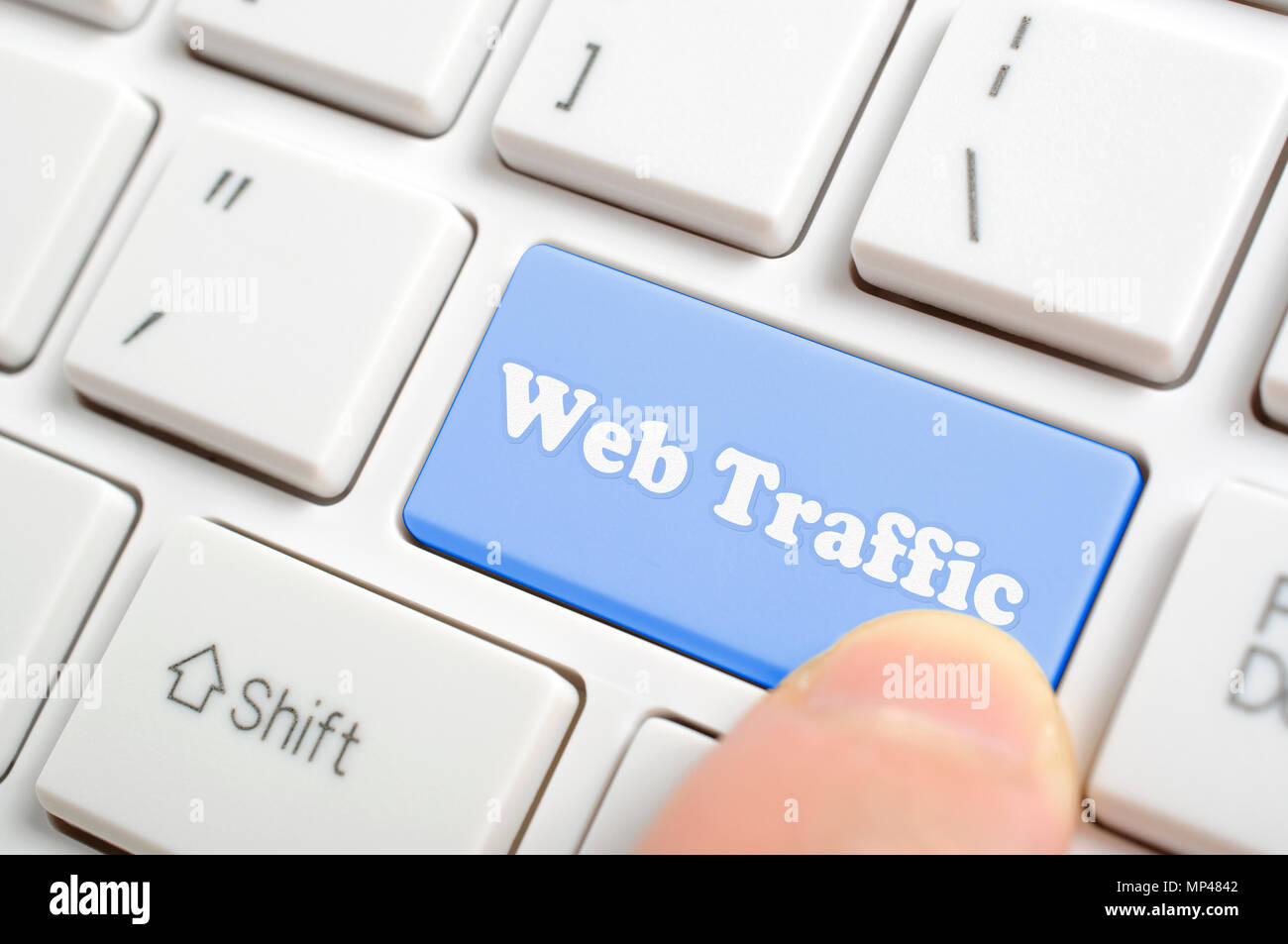 Pressing blue web traffic key on keyboard Stock Photo