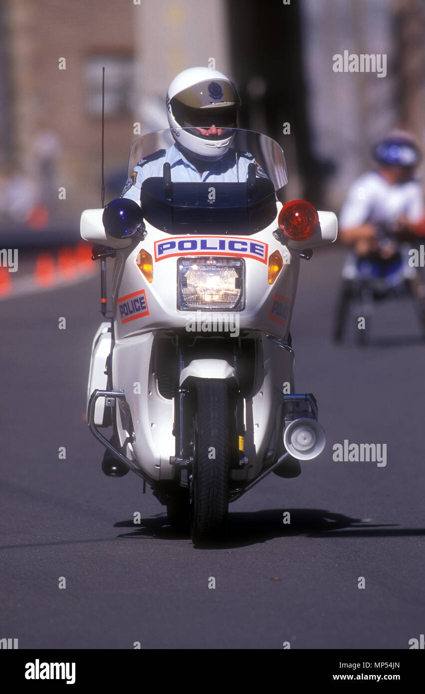 POLICEMAN ON MOTORBIKE DURING DISABLED SPORTING EVENT, SYDNEY, NEW SOUTH WALES, AUSTRALIA Stock Photo