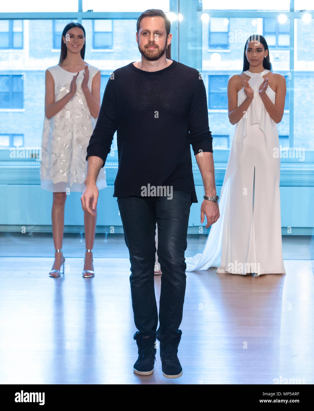 Designer Justin Alexander walks ...