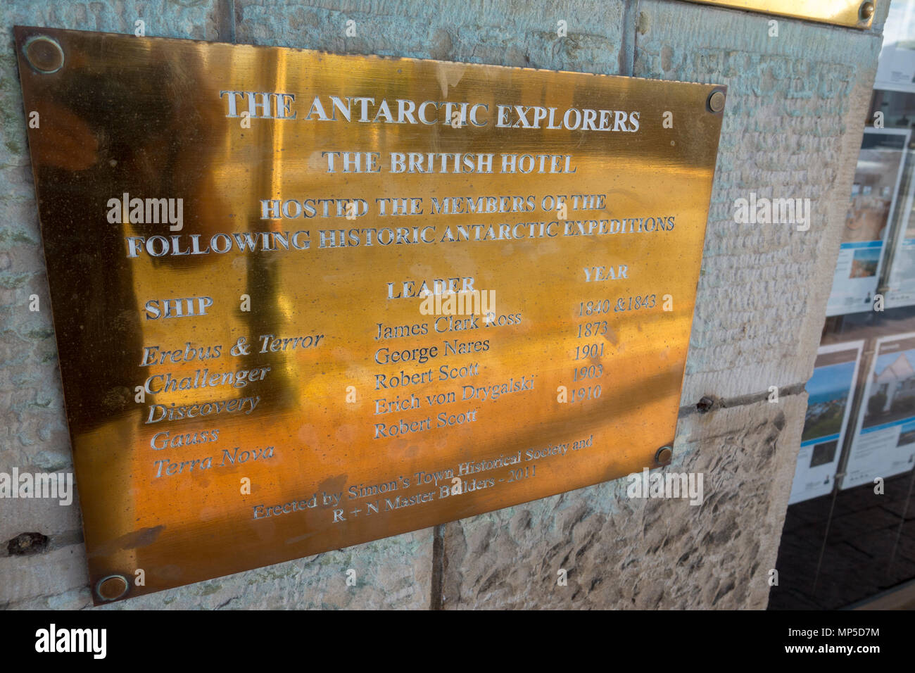 Brass plaque on the wall of The British Hotel in Simon's Town, South Africa, at which many 18th and 19th century Antarctic explorers stayed. Stock Photo