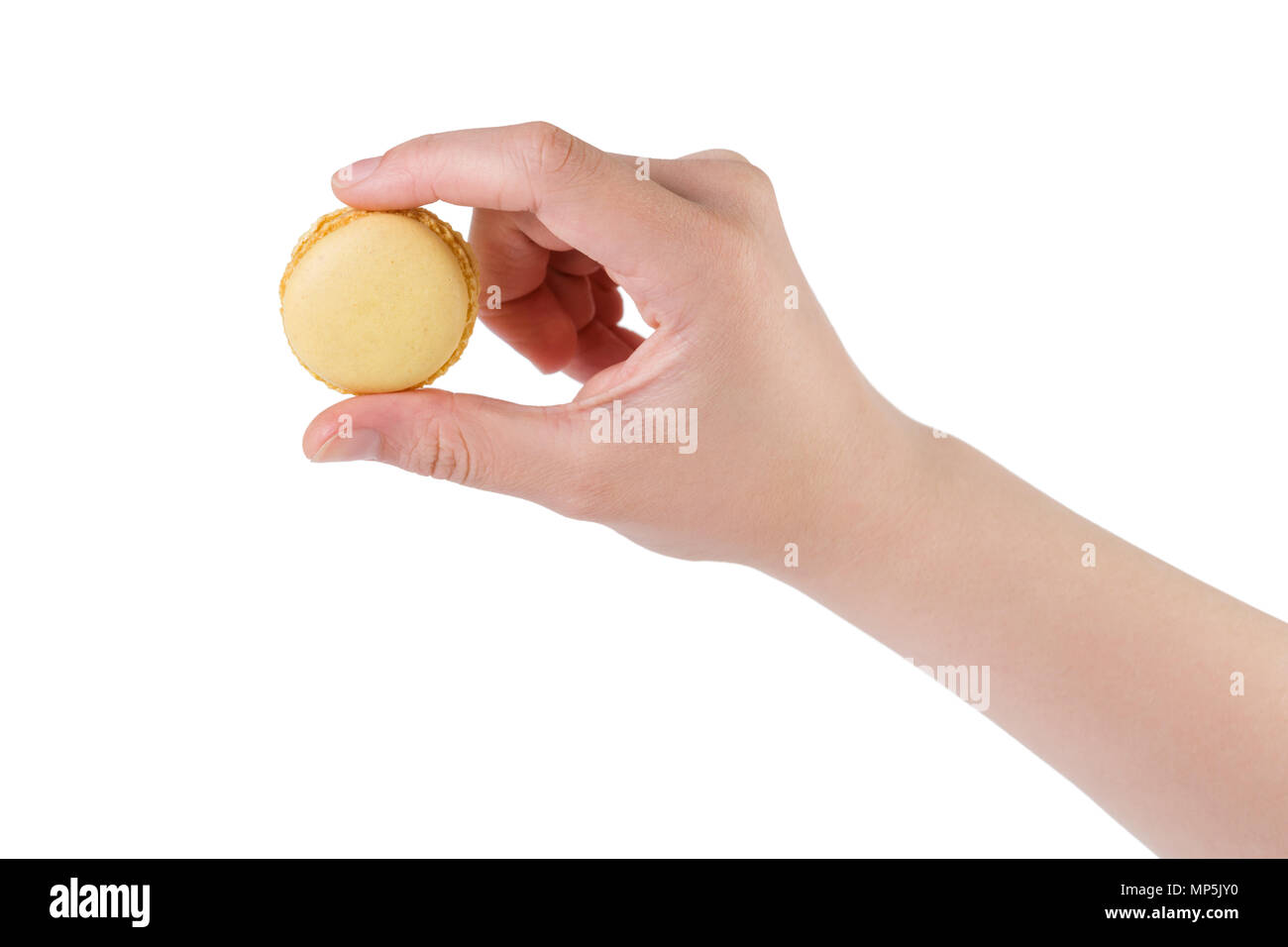 young female hand holding yellow macaron isolated on white Stock Photo