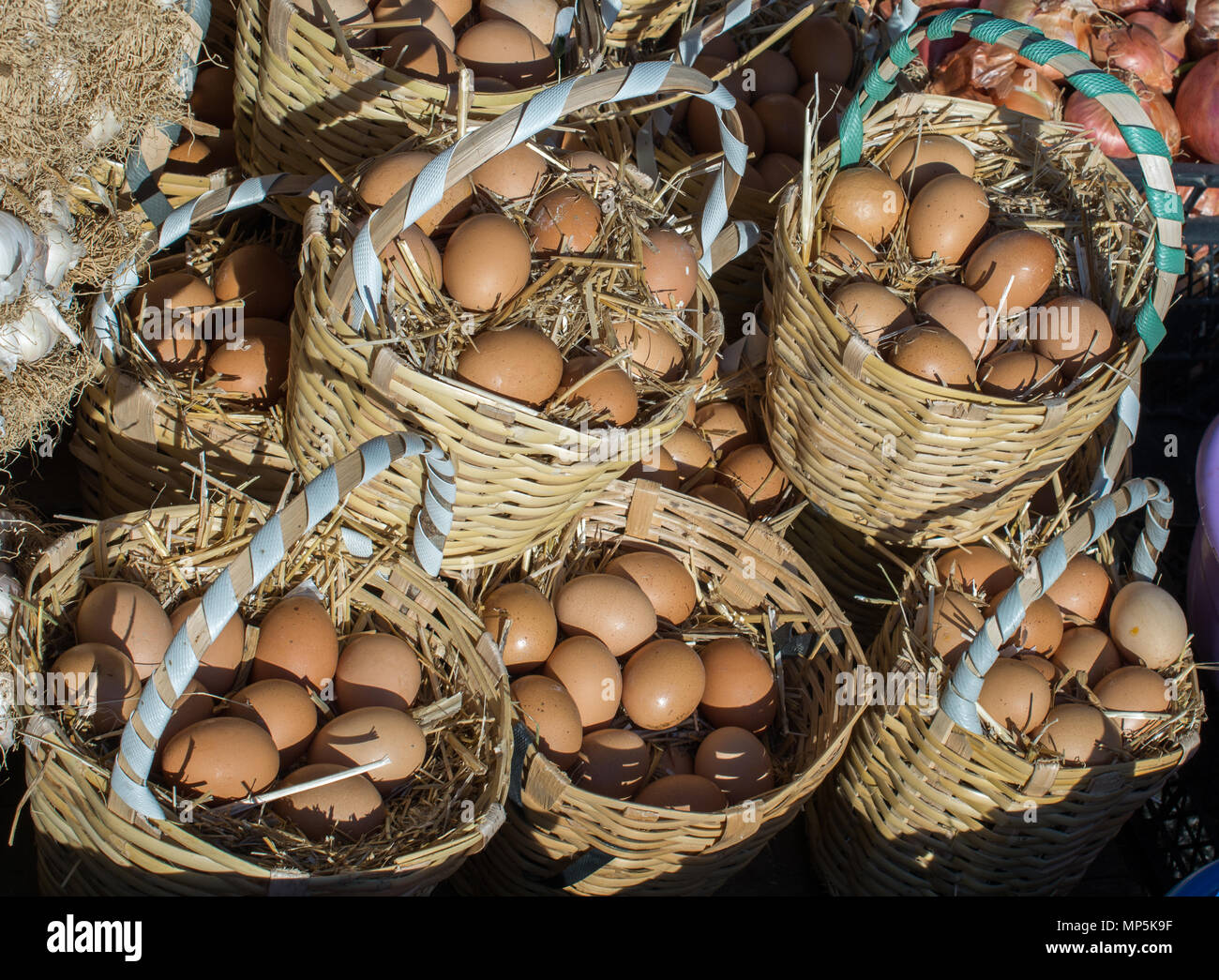 Organic fresh farm eggs in the straw basket Stock Photo - Alamy