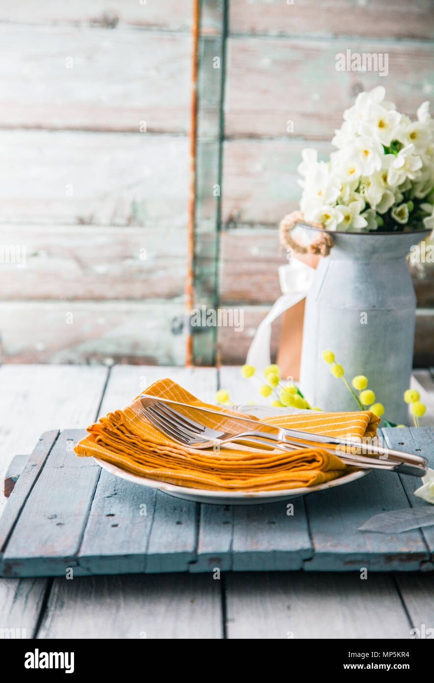 Spring table setting. Narcissus flower. Spring flowers Stock Photo