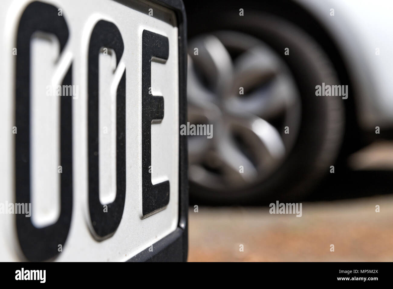 German number plate for electric cars with added letter ‘E’ at the end of the license number. Stock Photo