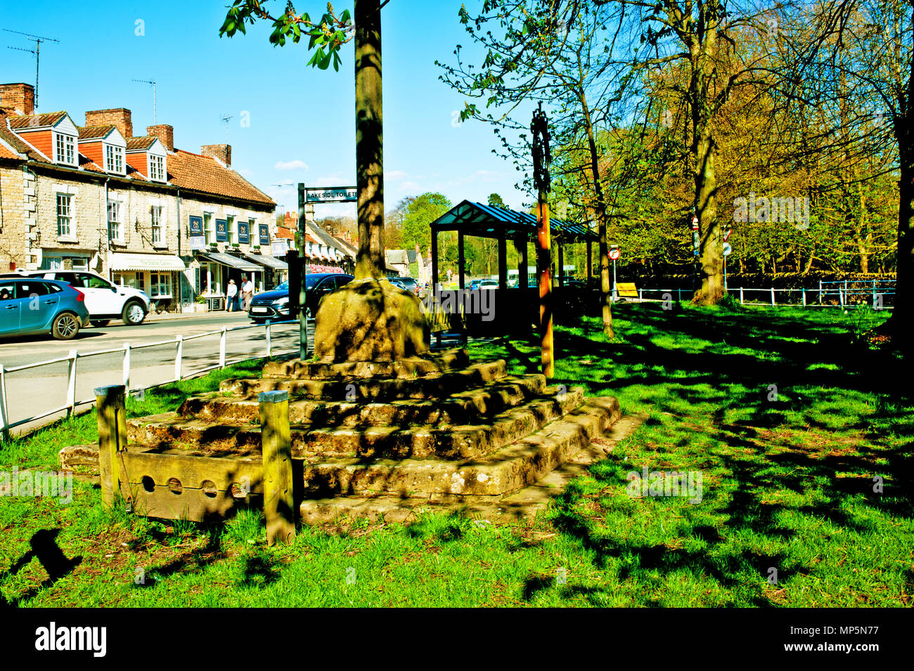 Village green and Stocks, Thornton Le Dale, England Stock Photo