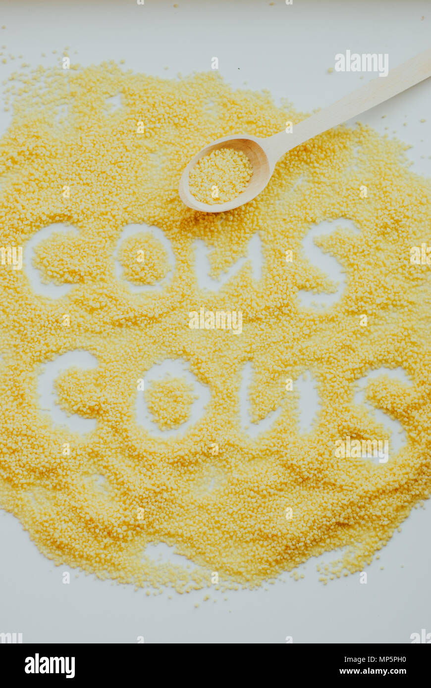 Raw cous cous background on white background Stock Photo