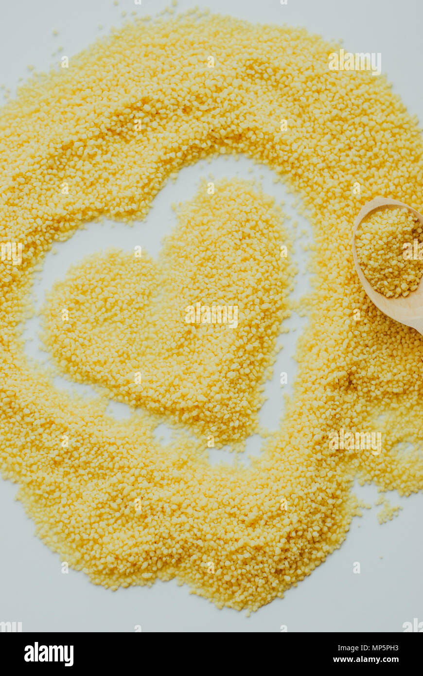 Raw cous cous background on white background Stock Photo
