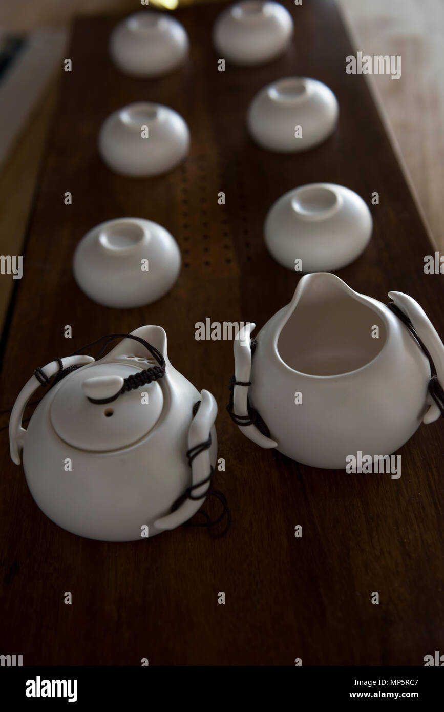 White tea kettle and tea cups. Stock Photo