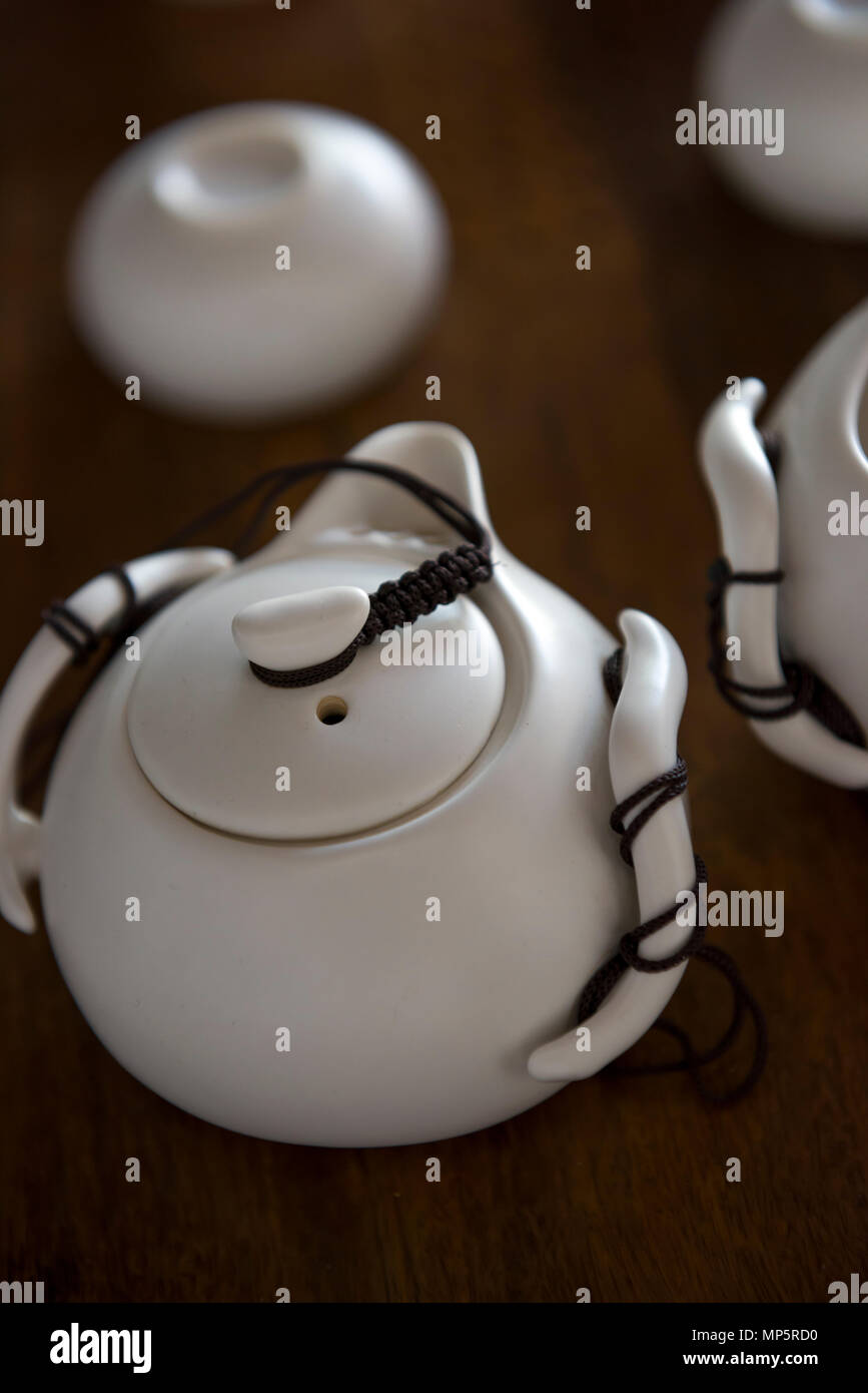 White tea kettle and tea cups. Stock Photo