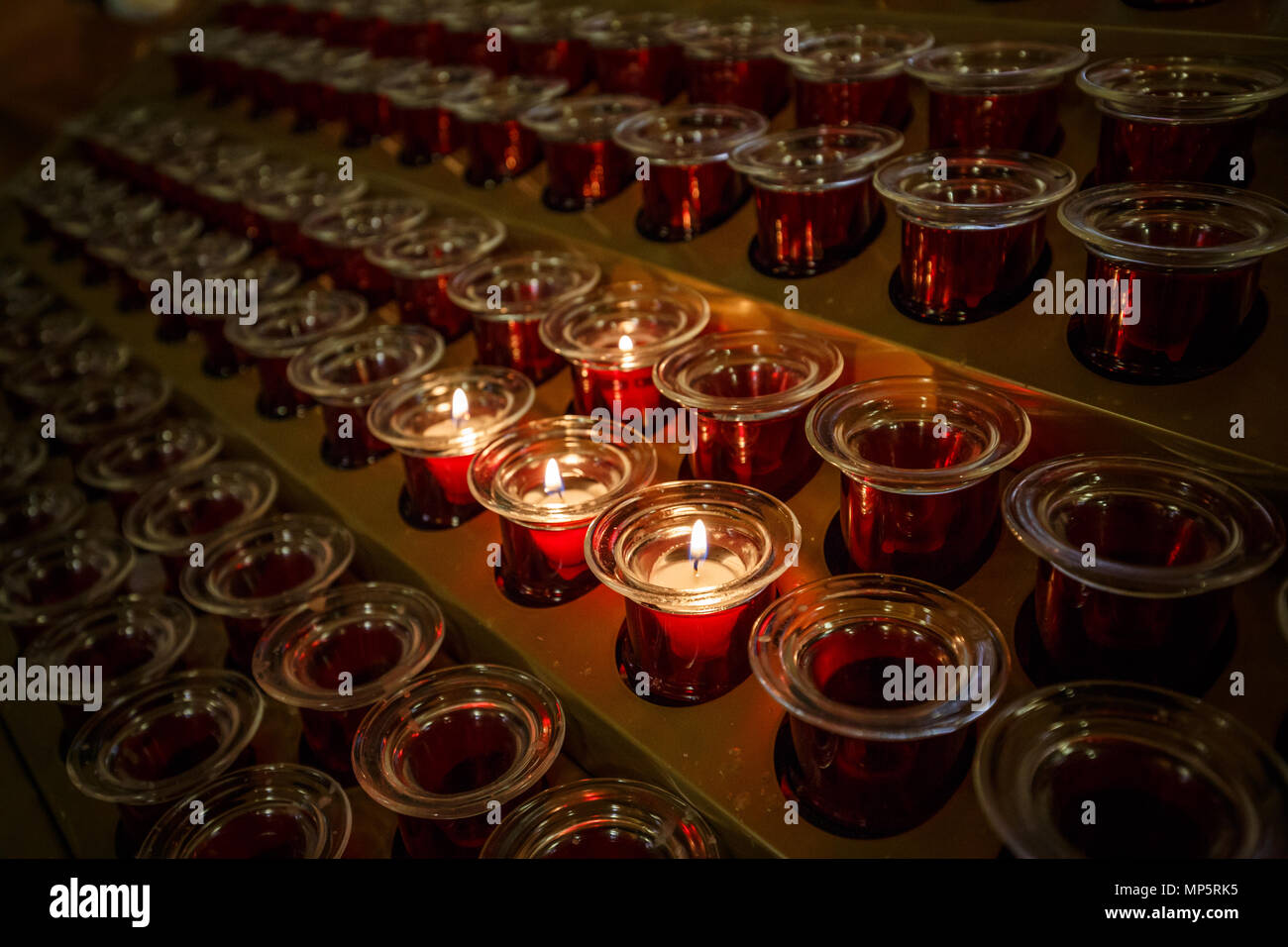 Burning candles in church, rows of candle Stock Photo Alamy