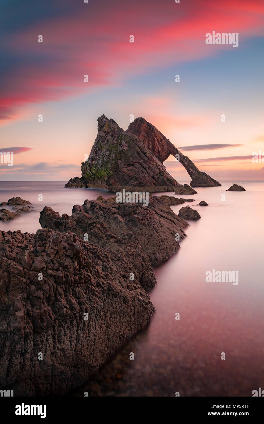 Sunset at Bow Fiddle Rock at Portknockie, Moray, Scottish coast, Scotlland, UK Stock Photo