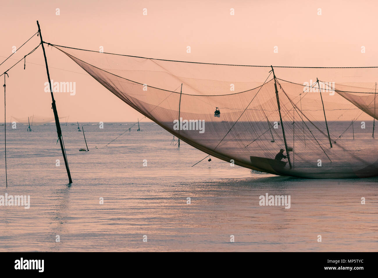 Fishermen fishing big net in hi-res stock photography and images