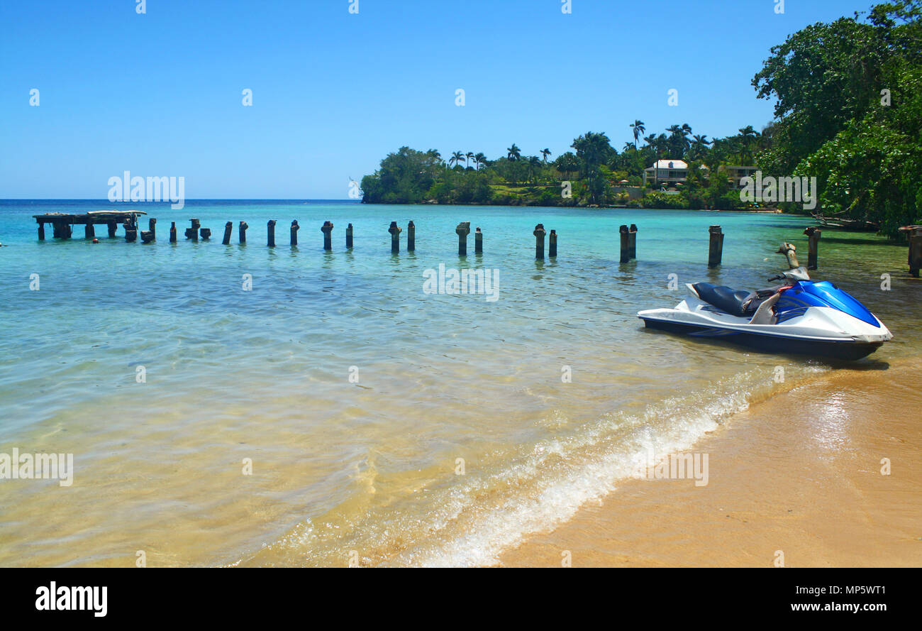 Exotic beach with nice blue ocean water and jet ski Stock Photo
