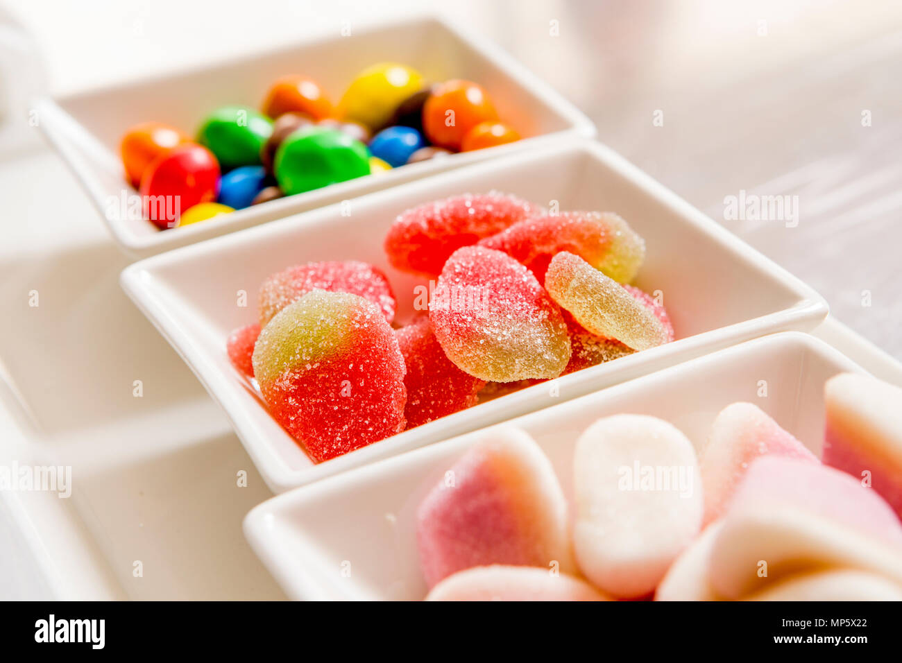 sugar candies in small bowls Stock Photo