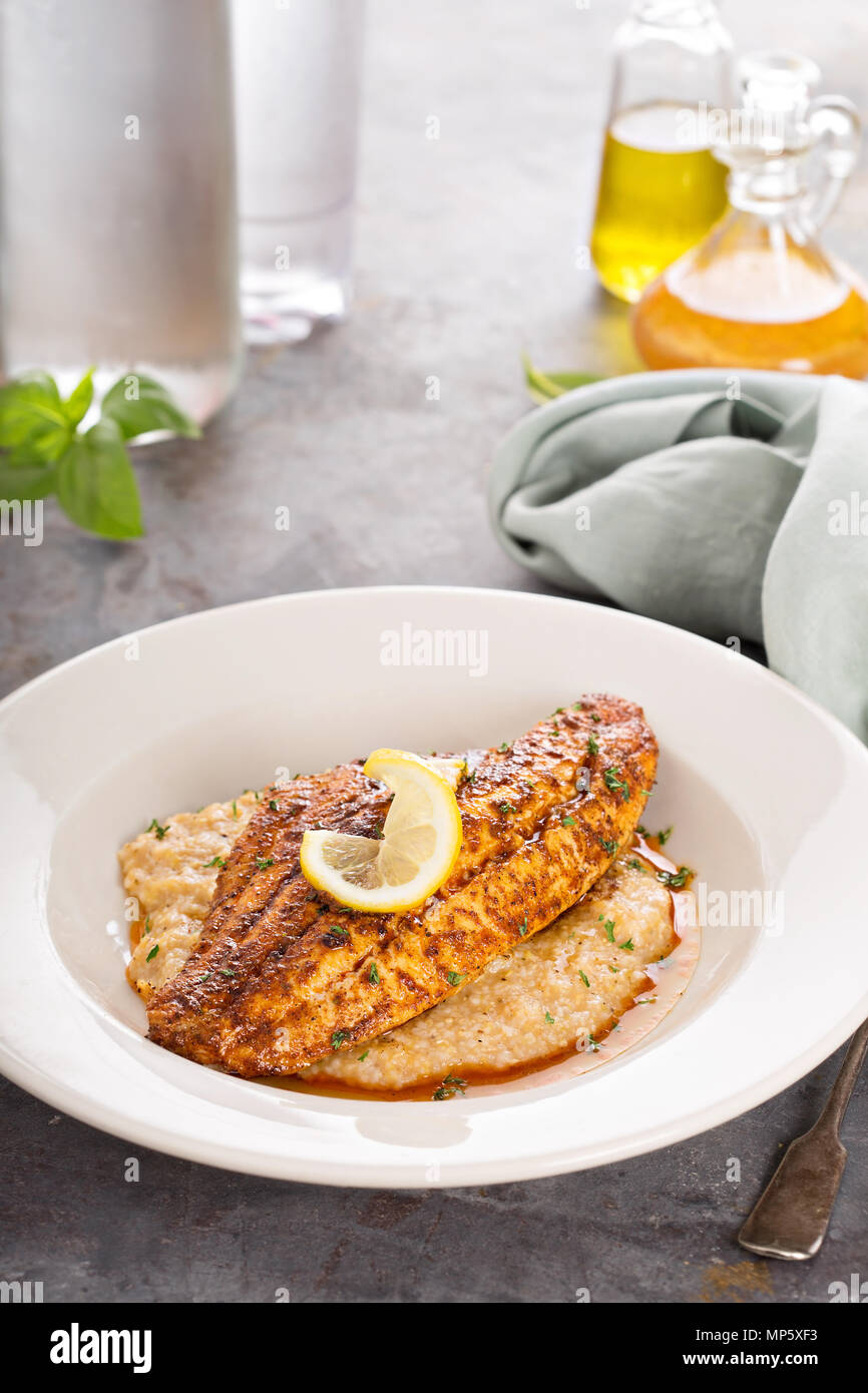 Grits with fried fish Stock Photo