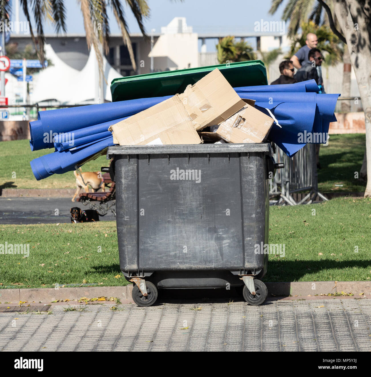 Cardboard and plastic in overflowing rubbish container in Spain Stock