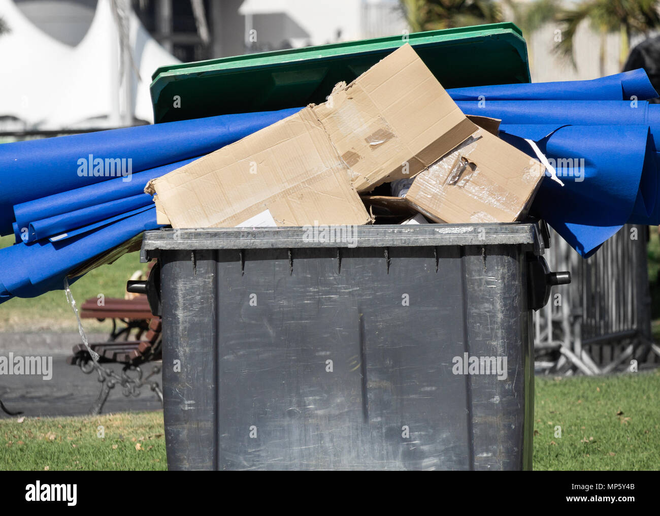 Cardboard and plastic in overflowing rubbish container in Spain Stock
