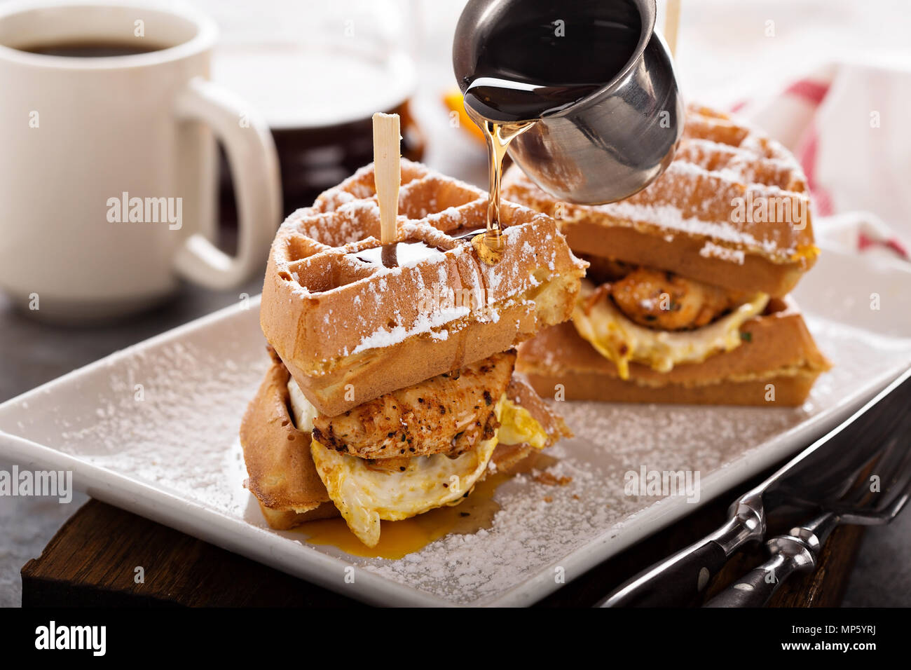 Waffle, fried egg and fish sandwich Stock Photo