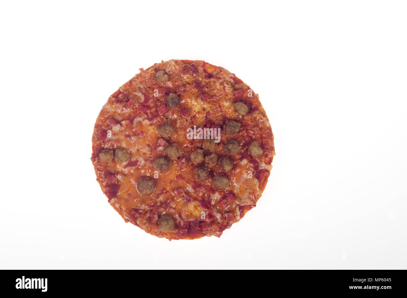 Small personal pizza with sausage and pepperoni meat along with tomato sauce and cheese Stock Photo