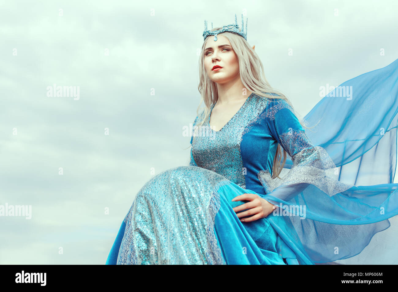 Portrait of a beautiful young woman elf in a blue dress Stock Photo