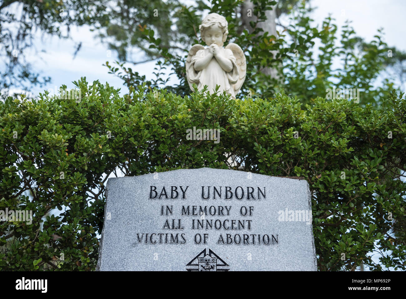Memorial headstone marker at Nombre de Dios Mission in St. Augustine, Florida to "Baby Unborn" in memory of all innocent victims of abortion. Stock Photo