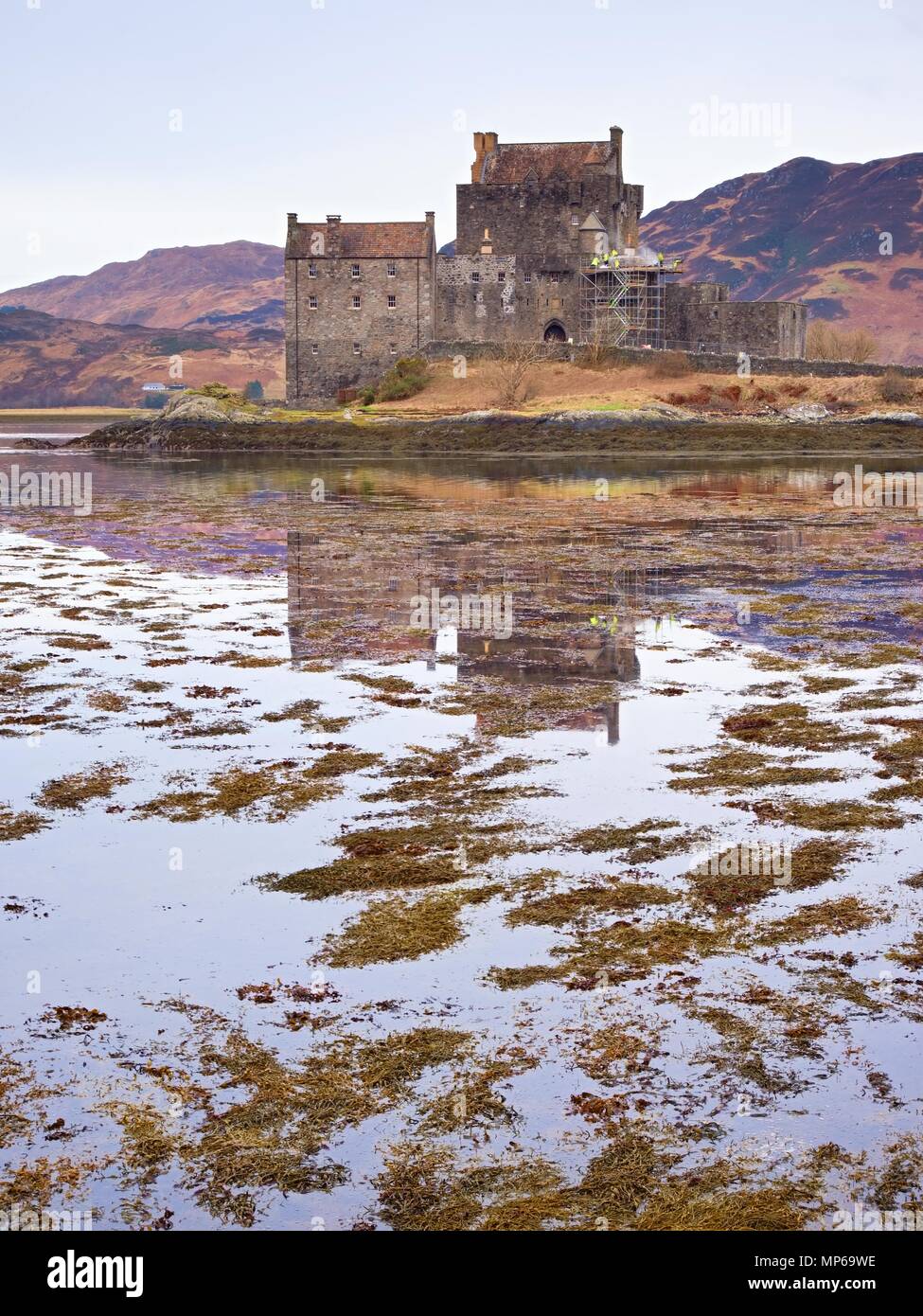Eilean Donan Castle with a stone bridge above the water, Scotland, It