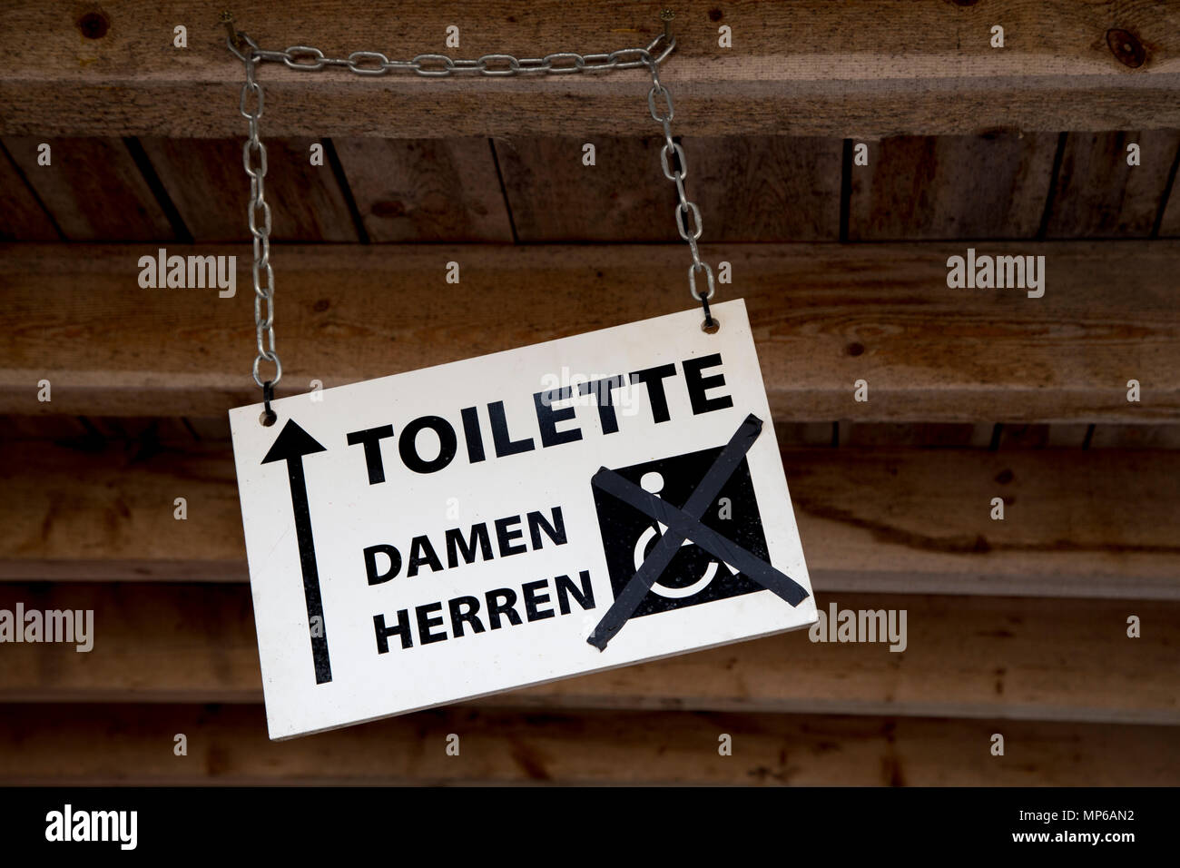 Sign Board Men Women Handicapped.- wheelchair accessible toilet is out of order Stock Photo