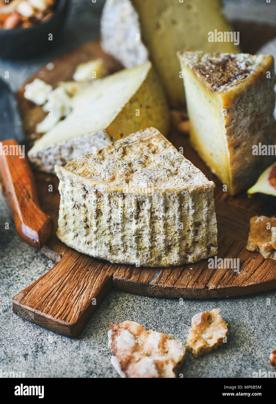 Cheese assortment on board, closeup, vertical composition Stock Photo