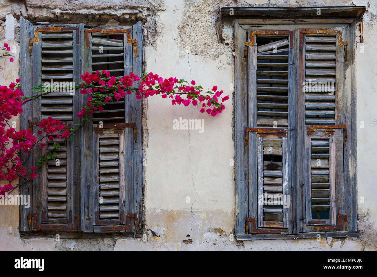 Windows of an old abandoned building in the old town of Athens, Greece ...